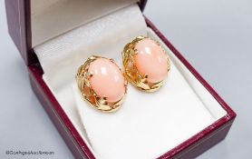 A modern pair of yellow metal (stamped 14k) and oval coral bead earrings, 16mm,gross weight 8.2
