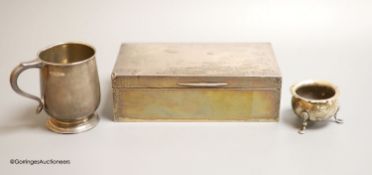 A George V silver rectangular cigarette box, Birmingham, 1926,16.5cm, a silver christening mug and