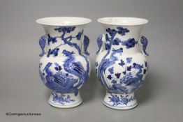 A pair of Chinese blue and white 'phoenix' vases, Kangxi marks but late 19th century, height 20cm (