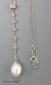 A modern white metal (stamped 14kt), cultured pearl and seven stone diamond chip set drop line