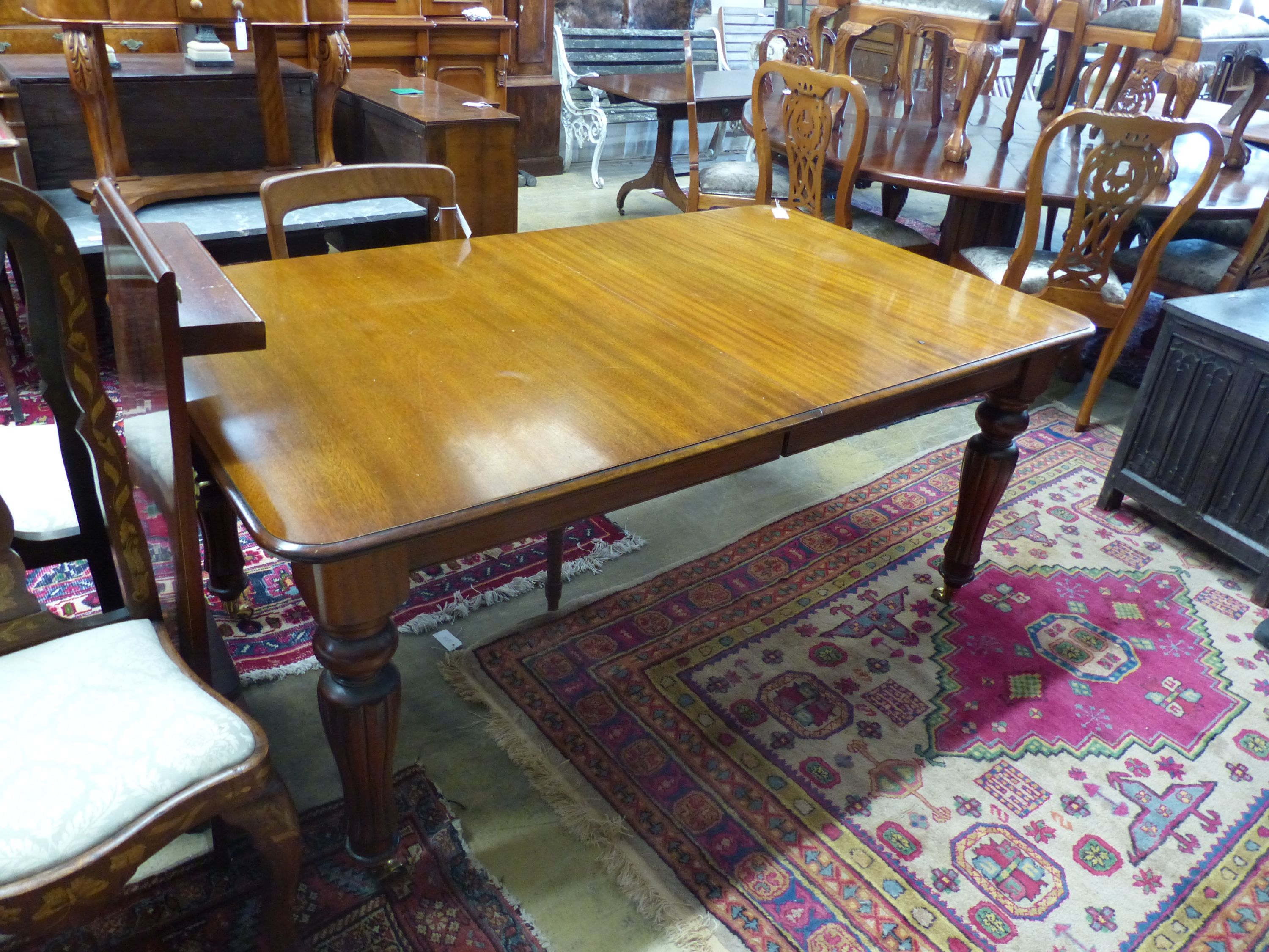 A Victorian mahogany extending dining table (one additional leaf), 250cm extended, width 100cm, - Image 2 of 2