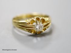 A modern 18ct gold and claw set solitaire diamond ring, size T/U, gross 5.9 grams,stone size