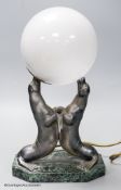 An Art Deco spelter and marble sea-lion desk lamp, height 34cm