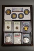 A group of US proof or uncirculated coins in capsules -Four Silver Eagle $1, 2011 2013 2012 x 2,