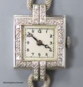 A lady's 1940's white metal (stamped platinum) and diamond set Vertex manual wind square dial