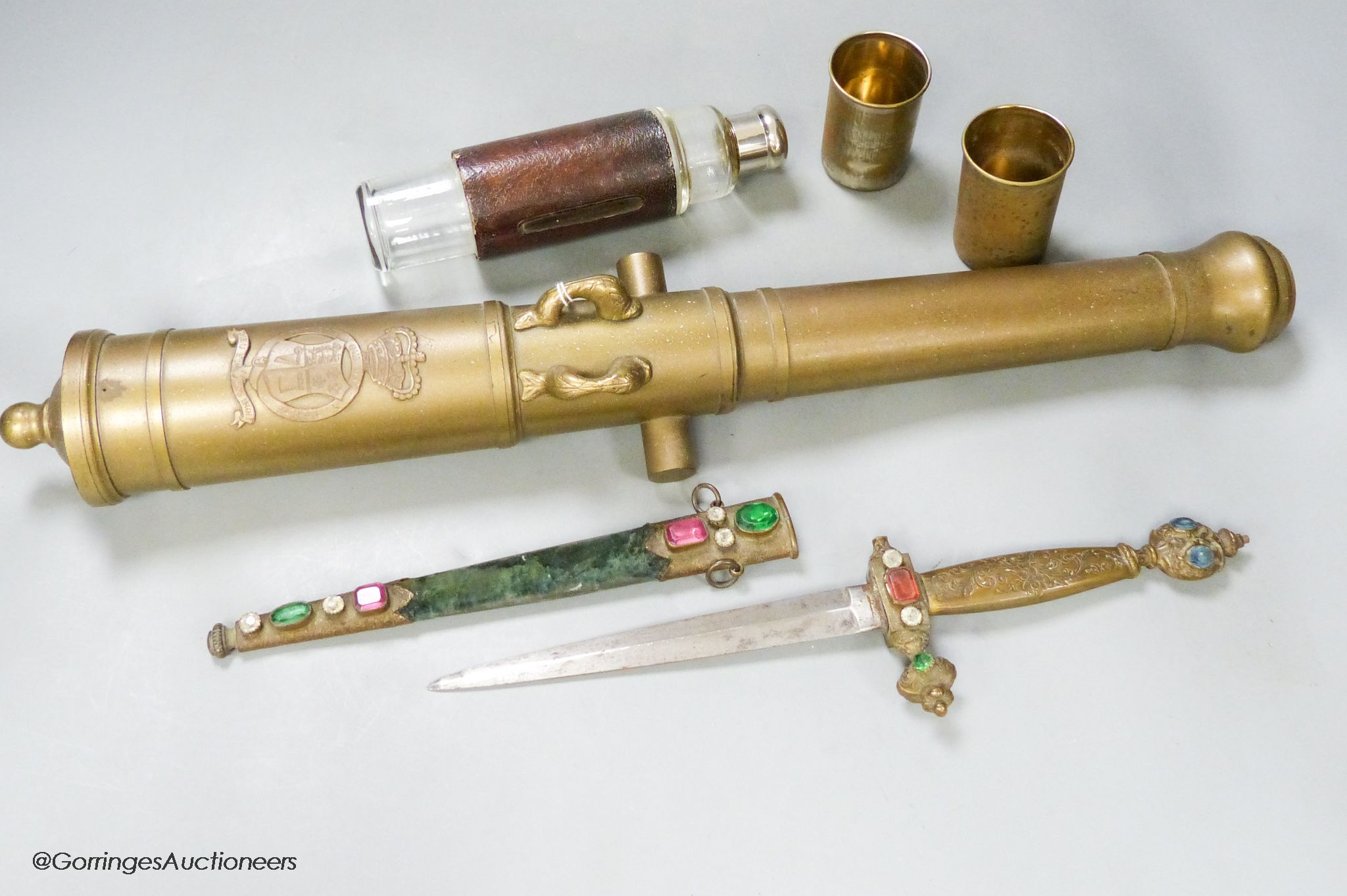A bronze model cannon barrel, a dagger and a leather cased 'toddy' bottle