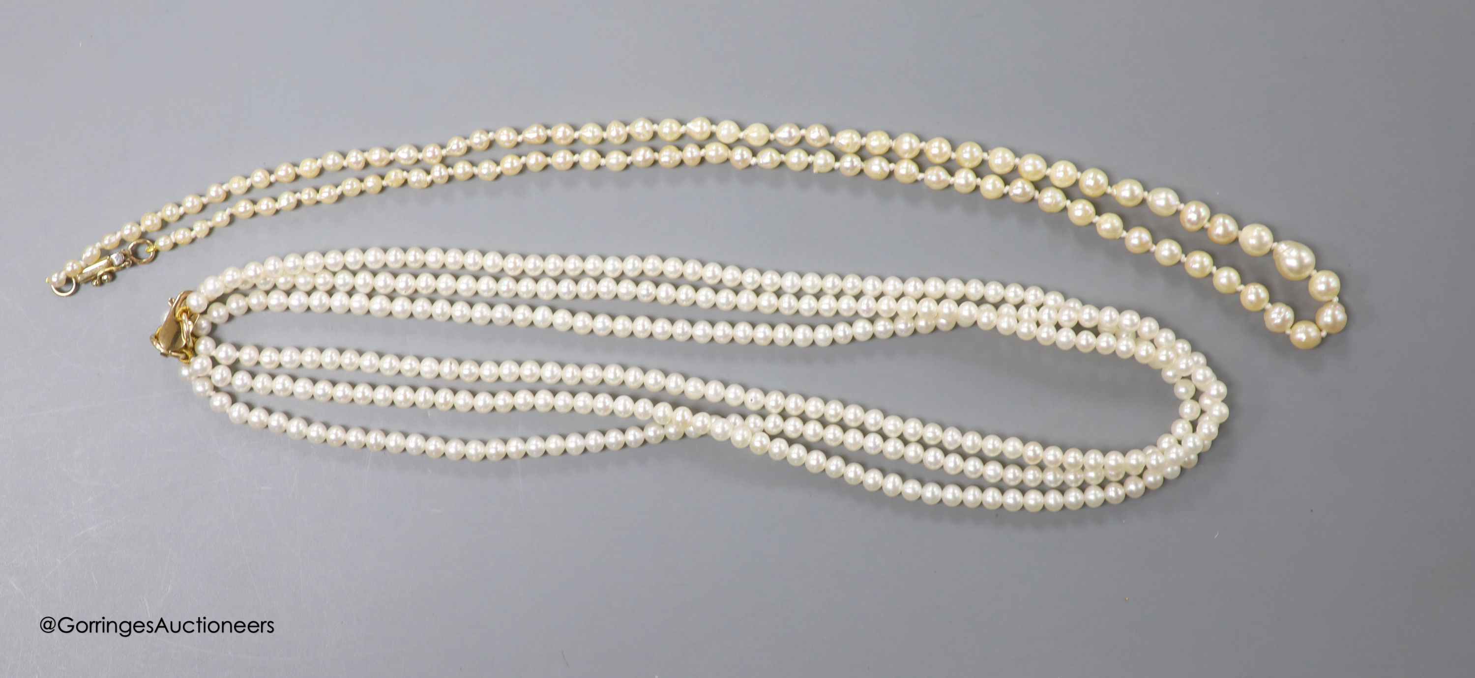 A triple strand cultured pearl choker necklace, with 375 clasp, 40cm and a single strand graduated - Image 2 of 2