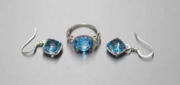 A modern 18ct white gold, blue topaz and diamond chip set dress ring, size L/M, gross 5 grams and a