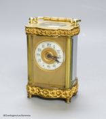 An Edwardian serpentine brass carriage timepiece, height 12cm