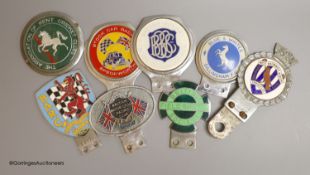 Eight various sports related car badges
