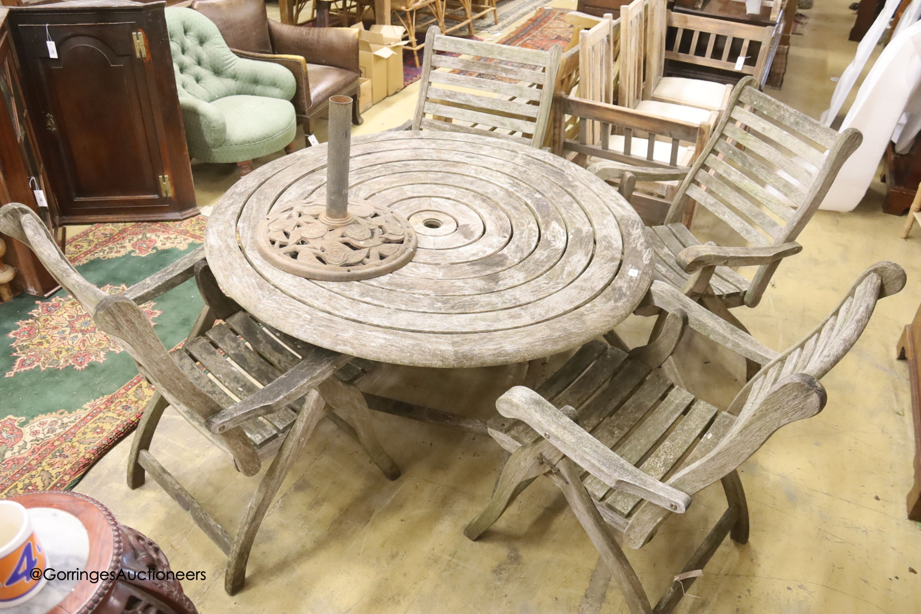 Alexander Rose weathered teak circular garden table, diameter 180cm, height 100cm and four folding