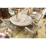 Alexander Rose weathered teak circular garden table, diameter 180cm, height 100cm and four folding