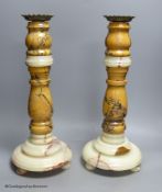 A large pair of 19th century variegated turned marble and onyx candlestands, height 46cm