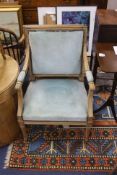 A pair of Louis XVI style beech elbow chairs, with fluted frames