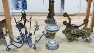 A cast brass electrolier, an ironwork exampleband a pair of table lamps