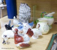 Two Crown Devon musical jugs and various pottery animals including a Staffordshire hen box and two