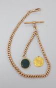 An Edwardian 9ct albert chain, 37.5cm, 33.3 grams. hung with a yellow metal and bloodstone and gold
