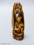 A Chinese ivory figure of a woman in a clam shell, 19th century