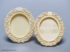 An associated pair of late 19th / early 20th century Canton carved ivory photo frames, 10cm high.