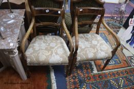 A pair of Regency period mahogany elbow chairs