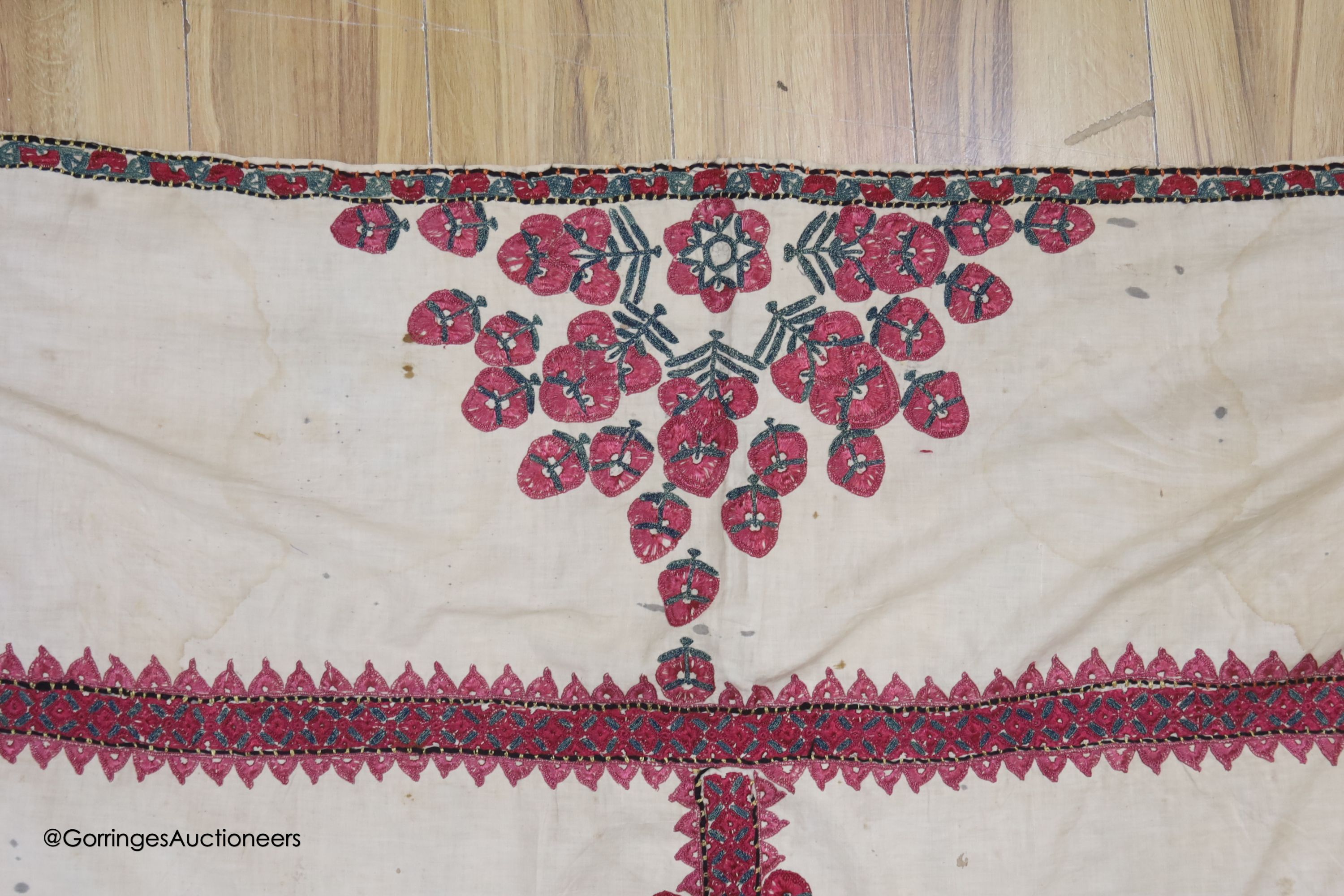 A silk embroidered Suzani, embroidered with cherry red flower heads with green stems and leaves in - Image 5 of 6