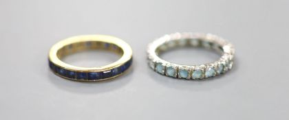 A yellow metal and sapphire set full eternity ring, size M, gross weight 2.8 grams and a white