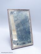 A George V silver mounted rectangular easel mirror, Walker & Hall, Sheffield, 1929, 32.8 grams.