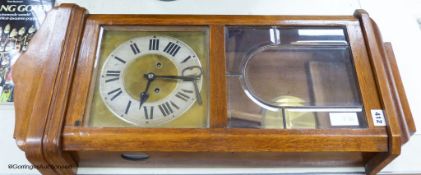 A 1920s German oak wall clock, height 78cm