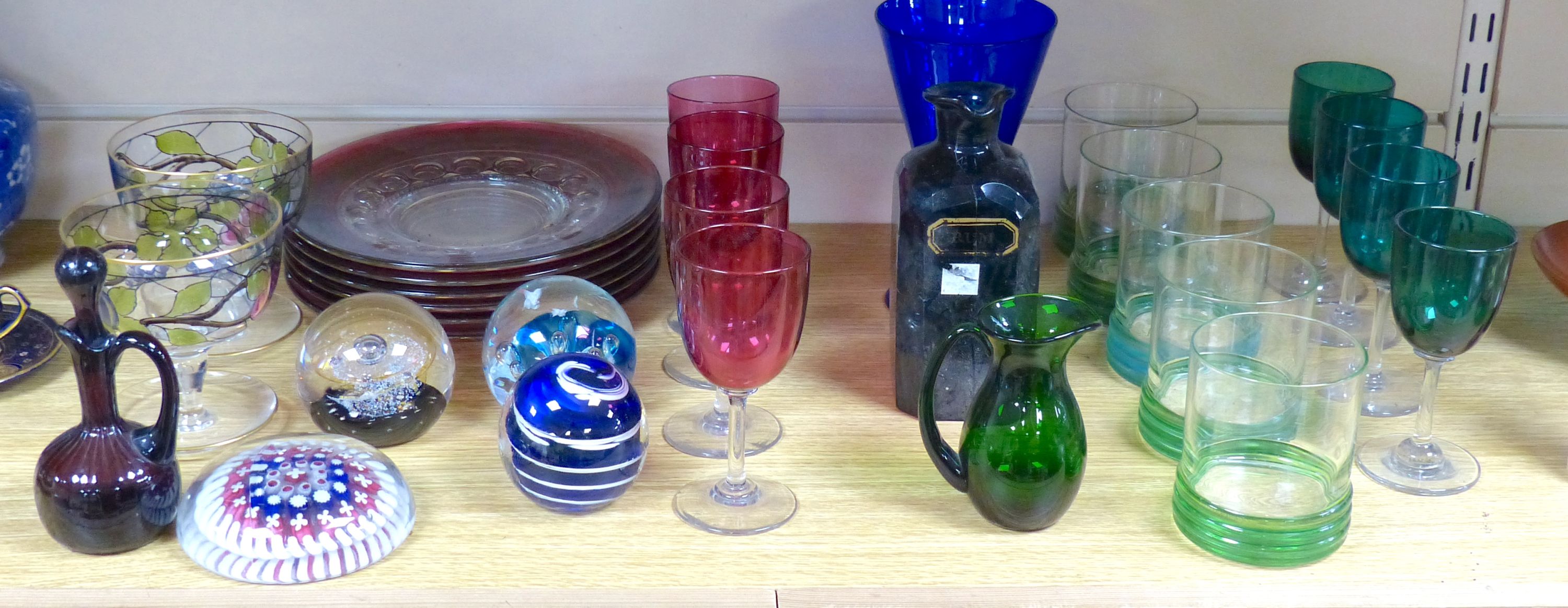 A quantity of mixed coloured glass and paper weights