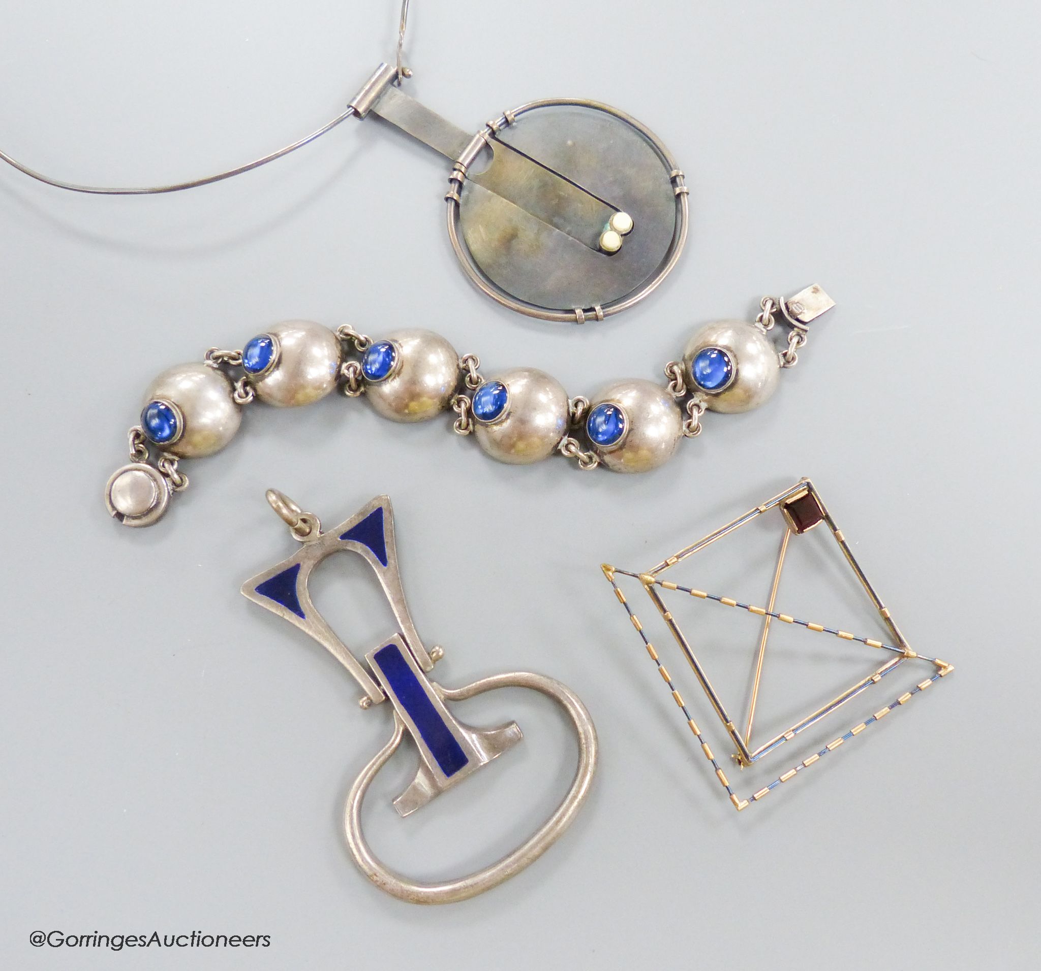 A stylish 1970's silver and blue enamel set pendant, maker E&N?, 78mm, gross 45.2 grams, a