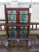 An Edwardian Liberty & Co. stained glass and beech leaded glass room screen, width 43cm, height