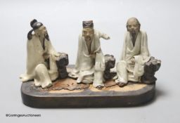 Three early 20th century Chinese stoneware figures of gentleman, height 9cm