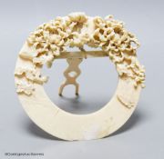 A late 19th century Japanese circular easel-backed carved ivory picture frame, diameter 14cm