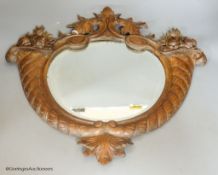A carved wood continental wall mirror, 50 x 48cm