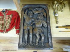 A 16th / 17th century style carved oak panel, 42 x 66cm.