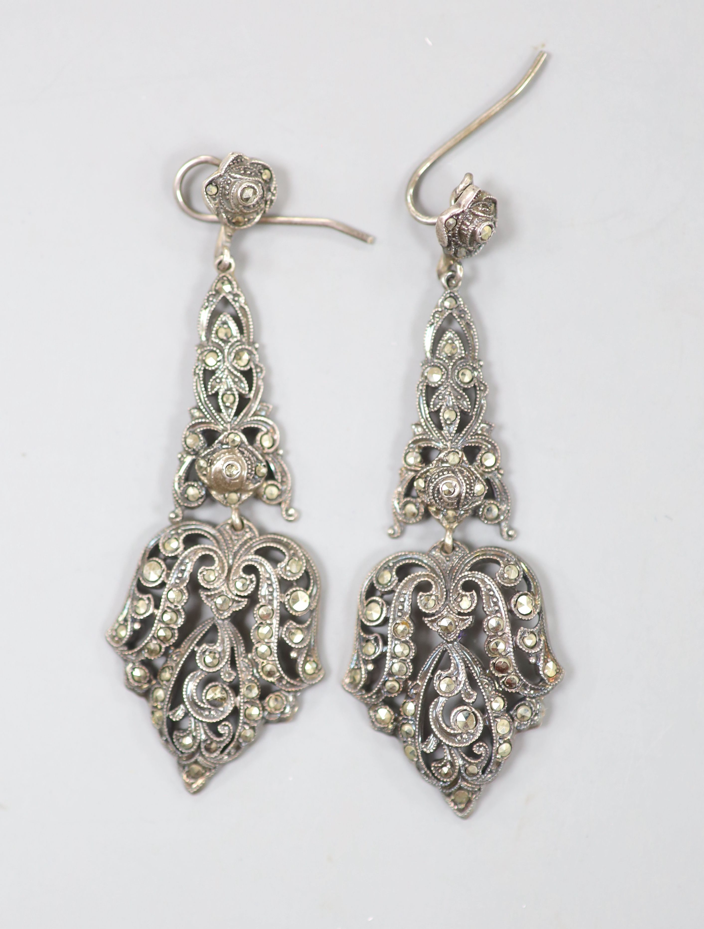 A pair of white metal and marcasite set drop earrings, 63mm.