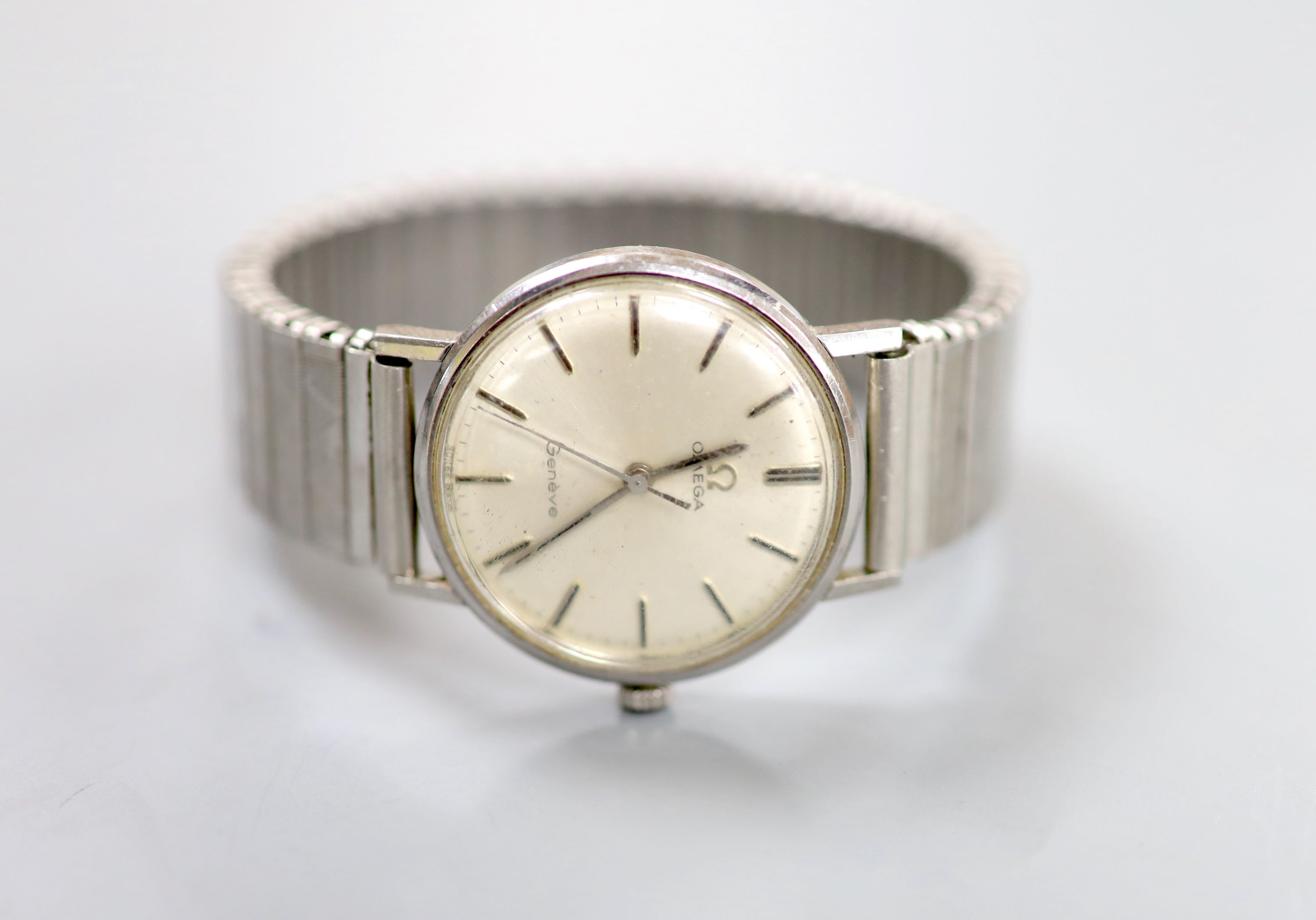 A gentleman's 1960's steel Omega manual wind wrist watch, on an associated flexible strap,case