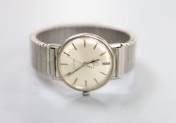 A gentleman's 1960's steel Omega manual wind wrist watch, on an associated flexible strap,case