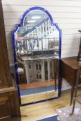 A large arched glass mirror, with blue glass borders, width 89cm, height 183cm