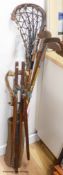 A collection of vintage golf clubs, three hickory shaft and golf bag with folding stand