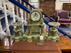 A gilt metal and onyx mantel clock garniture, height 47cm