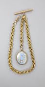 A Victorian gilt metal and enamel oval locket, 29mm, together with a fancy double link albert,