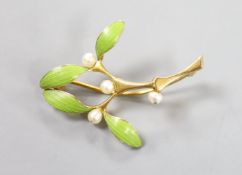 An Art Nouveau yellow metal, green enamel and seed pearl set foliate brooch, 38mm, gross weight 5.2