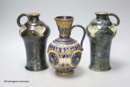 A pair of Doulton ewers and Doulton single ewer