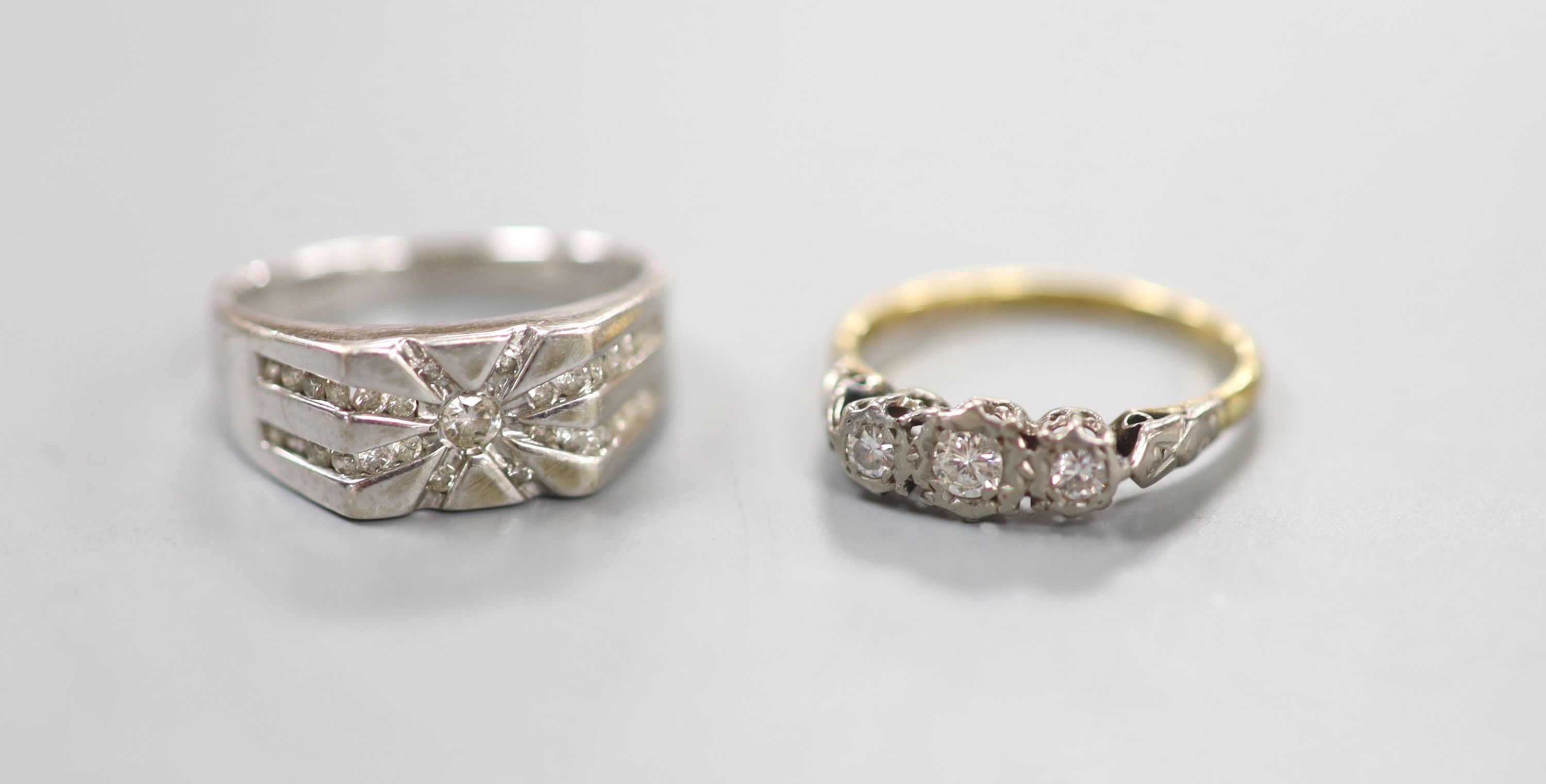 A diamond-set 14ct white gold ring, size R, gross 5.7 grams and an illusion-set three-stone diamond