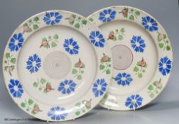 A pair of Continental polychrome faience chargers, late 19th century, height 33cm - one cracked