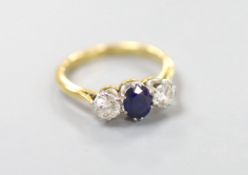 An 18ct & plat, sapphire and diamond three stone ring, size O, gross weight 3.4 grams,the oval cut