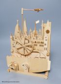 A modern mechancal lightwood diorama of a cityscape, height 26cm