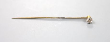 A solitaire diamond set stick pin, 63mm, gross 1.3 grams,stone weighing approx. 0.25ct.