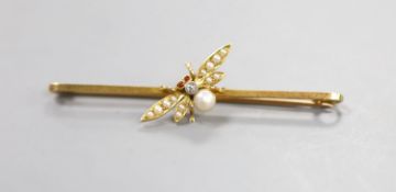 An Edwardian 15ct, diamond and seed pearl set bug bar brooch, with cabochon eyes, 53mm, gross 3.3.